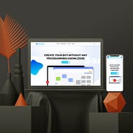 A laptop and a smartphone display a website for creating bots without programming knowledge. Elements around include geometric shapes, vases, and an orange leaf for decoration. The clean, modern web design features dominant blue and white colors.